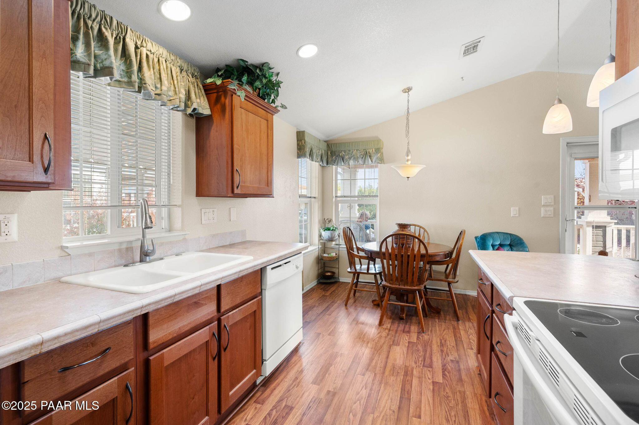 2214 Dove Drive Dewey, AZ 86327 - Photo 16 of 27 a kitchen with a table chairs sink and cabinets