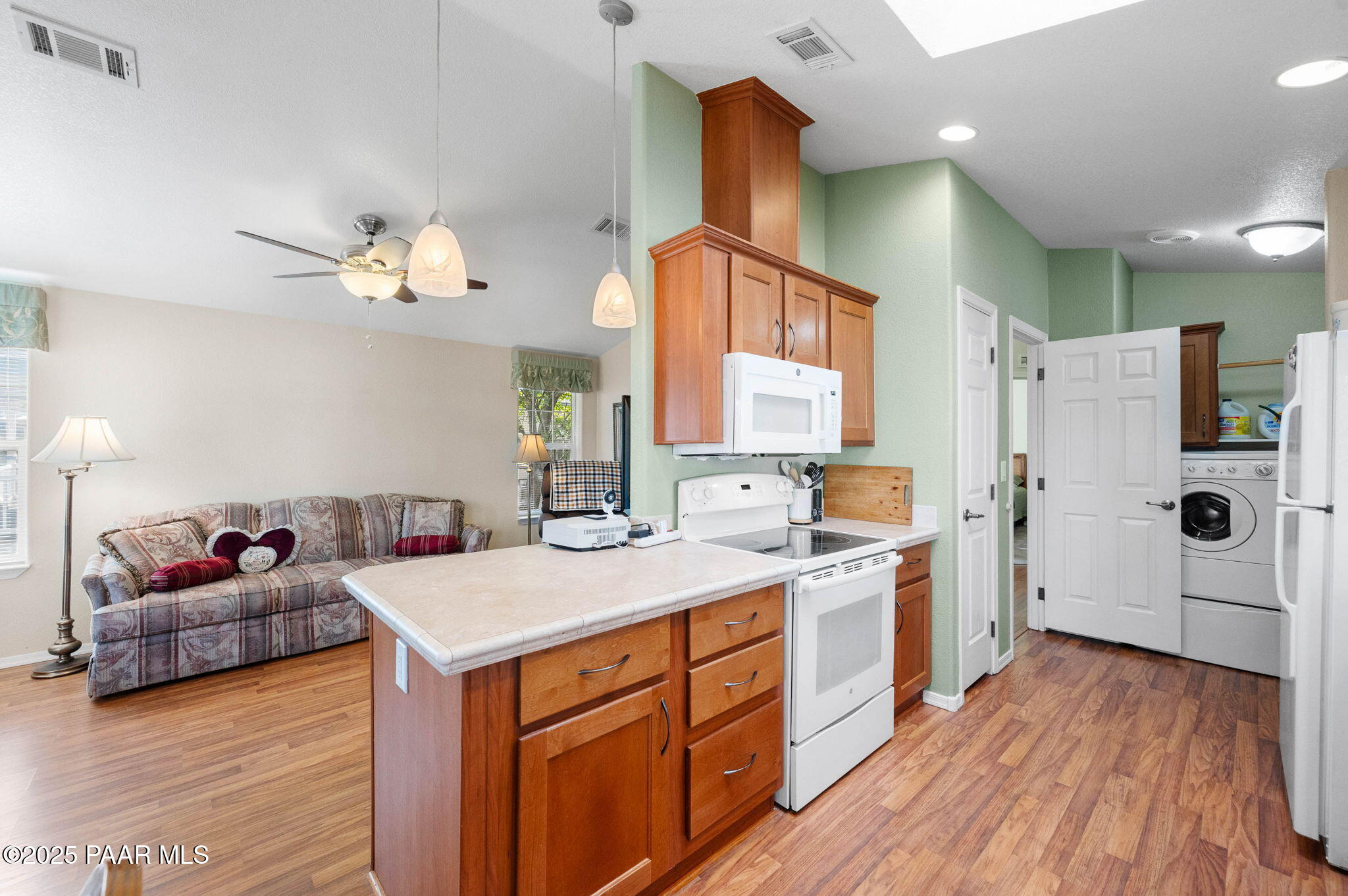 2214 Dove Drive Dewey, AZ 86327 - Photo 17 of 27 a kitchen with a sink dishwasher a refrigerator and cabinets