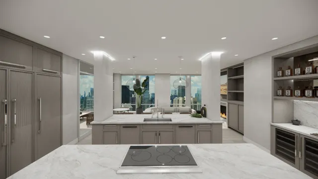 a living room with stainless steel appliances furniture a rug and a kitchen view