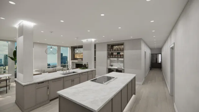 a kitchen with a sink a counter top space stainless steel appliances and cabinets