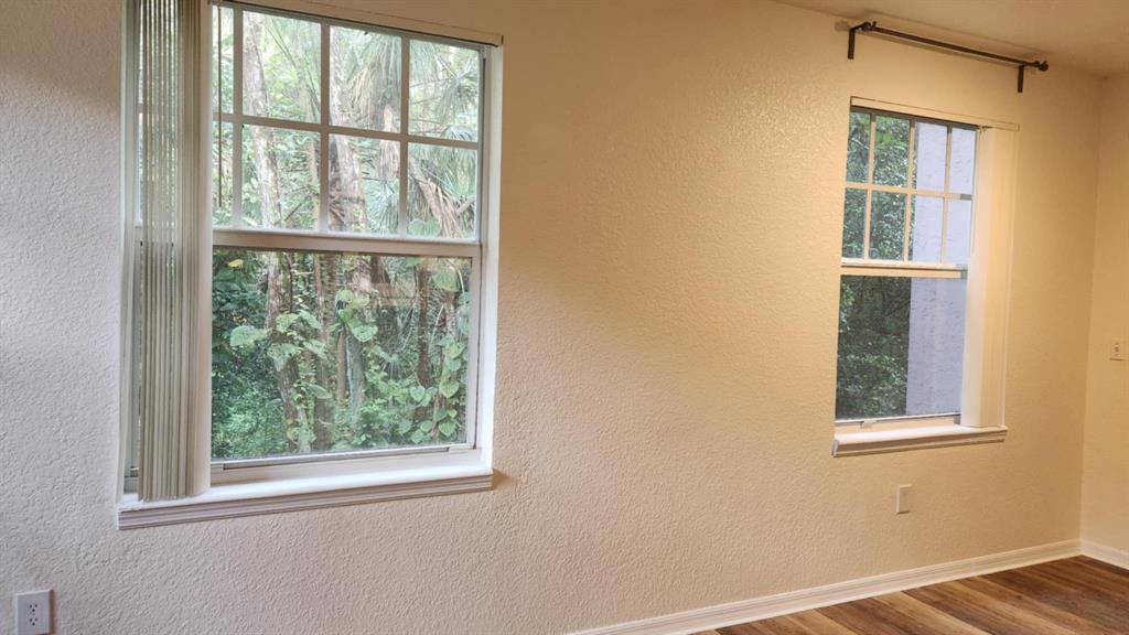 6884 West Sample Road, Unit 6884 Coral Springs, FL 33067 - Photo 7 of 14 a view of an empty room with a window