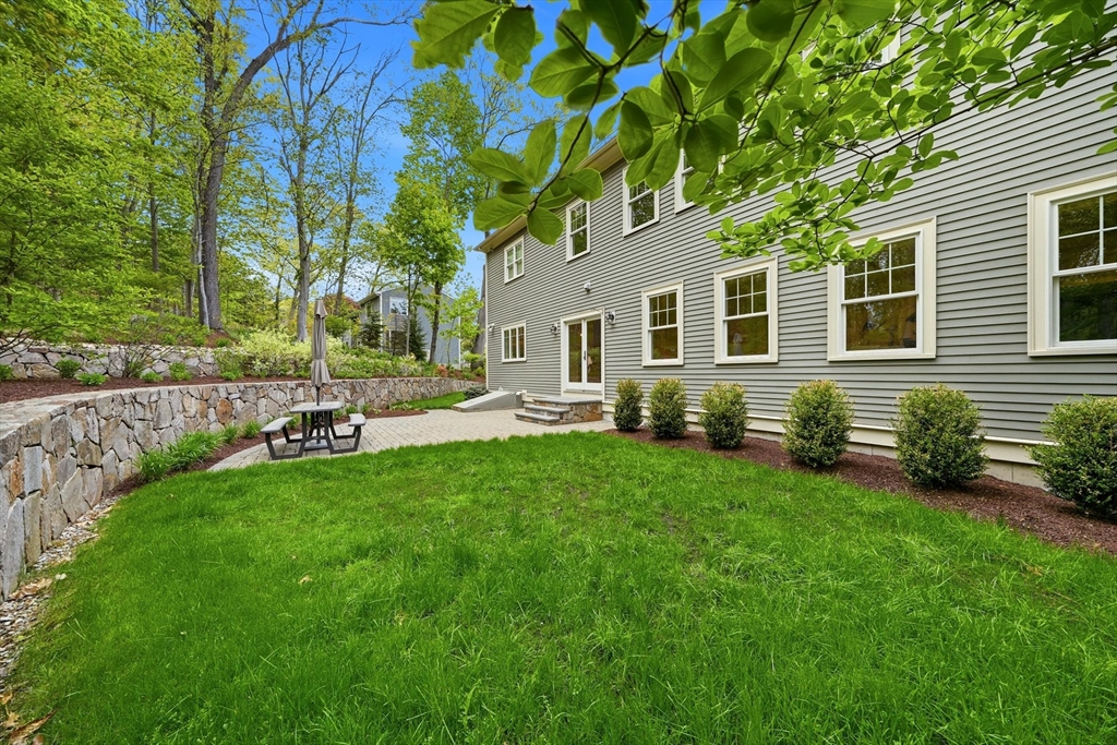 6 Flintlock Road Lexington, MA 02420 - Photo 38 of 39 a front view of house with yard and green space