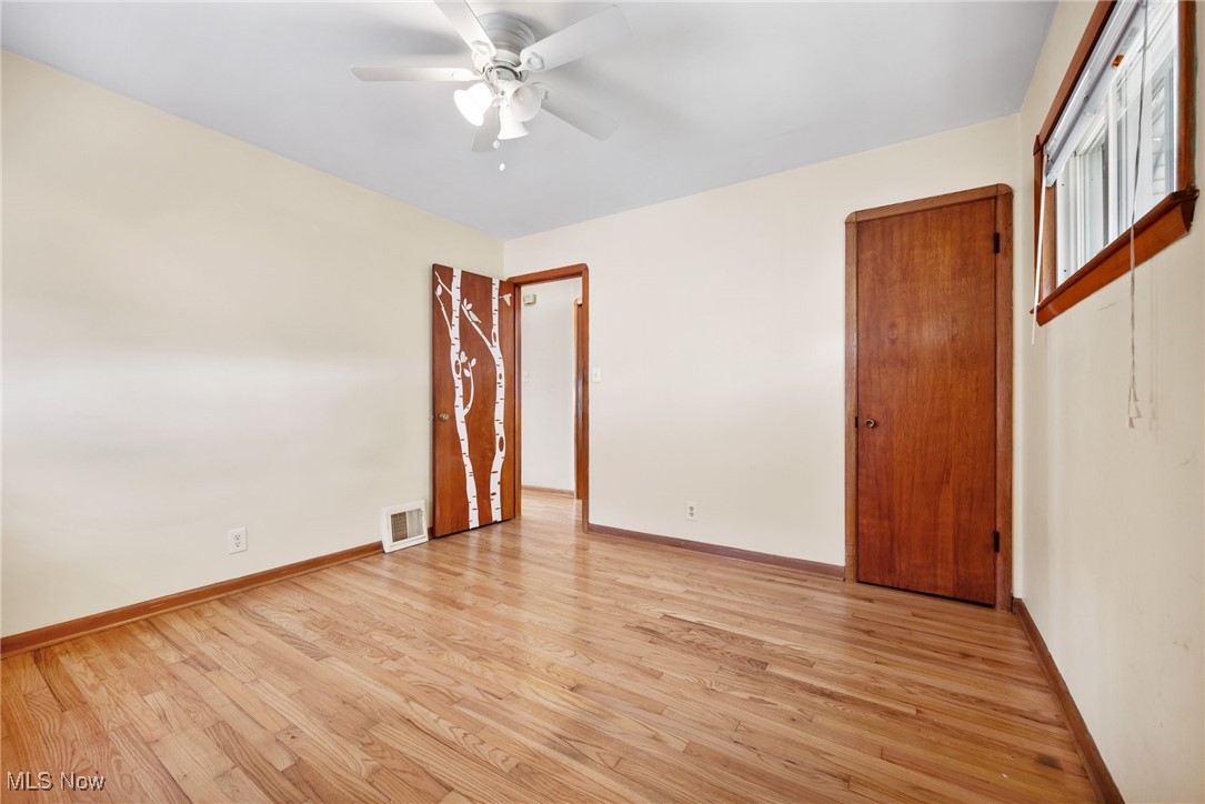 16913 Martha Road Cleveland, OH 44135 - Photo 16 of 26 Empty room featuring ceiling fan and light hardwood / wood-style flooring