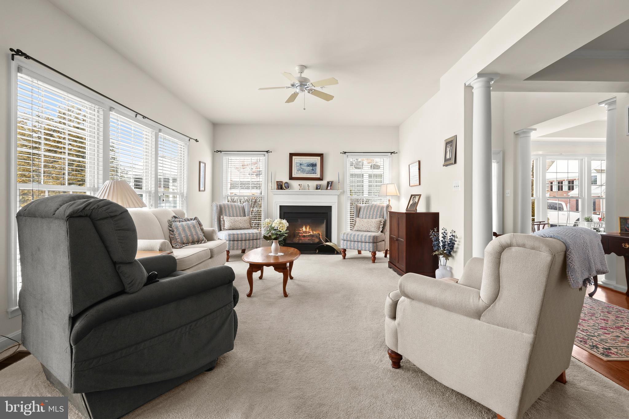 804 Bridle Path Bel Air, MD 21014 - Photo 12 of 53 a living room with furniture a fireplace and a large window