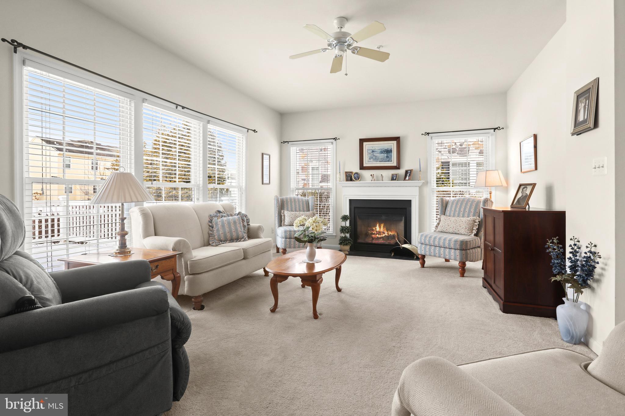 804 Bridle Path Bel Air, MD 21014 - Photo 13 of 53 a living room with furniture a fireplace and a large window
