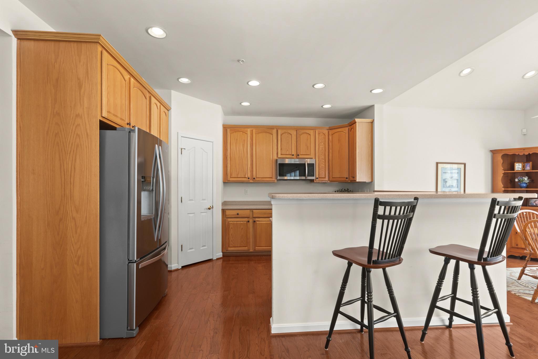 804 Bridle Path Bel Air, MD 21014 - Photo 17 of 53 a kitchen with stainless steel appliances granite countertop a refrigerator and a stove top oven