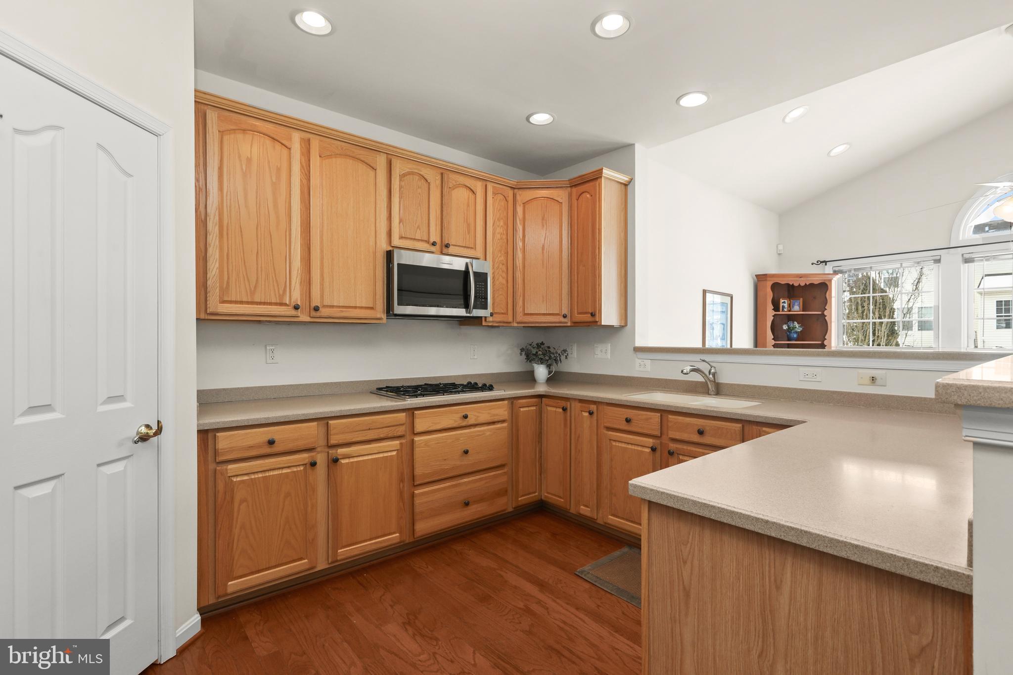 804 Bridle Path Bel Air, MD 21014 - Photo 18 of 53 a kitchen with stainless steel appliances granite countertop wooden cabinets a sink and a stove