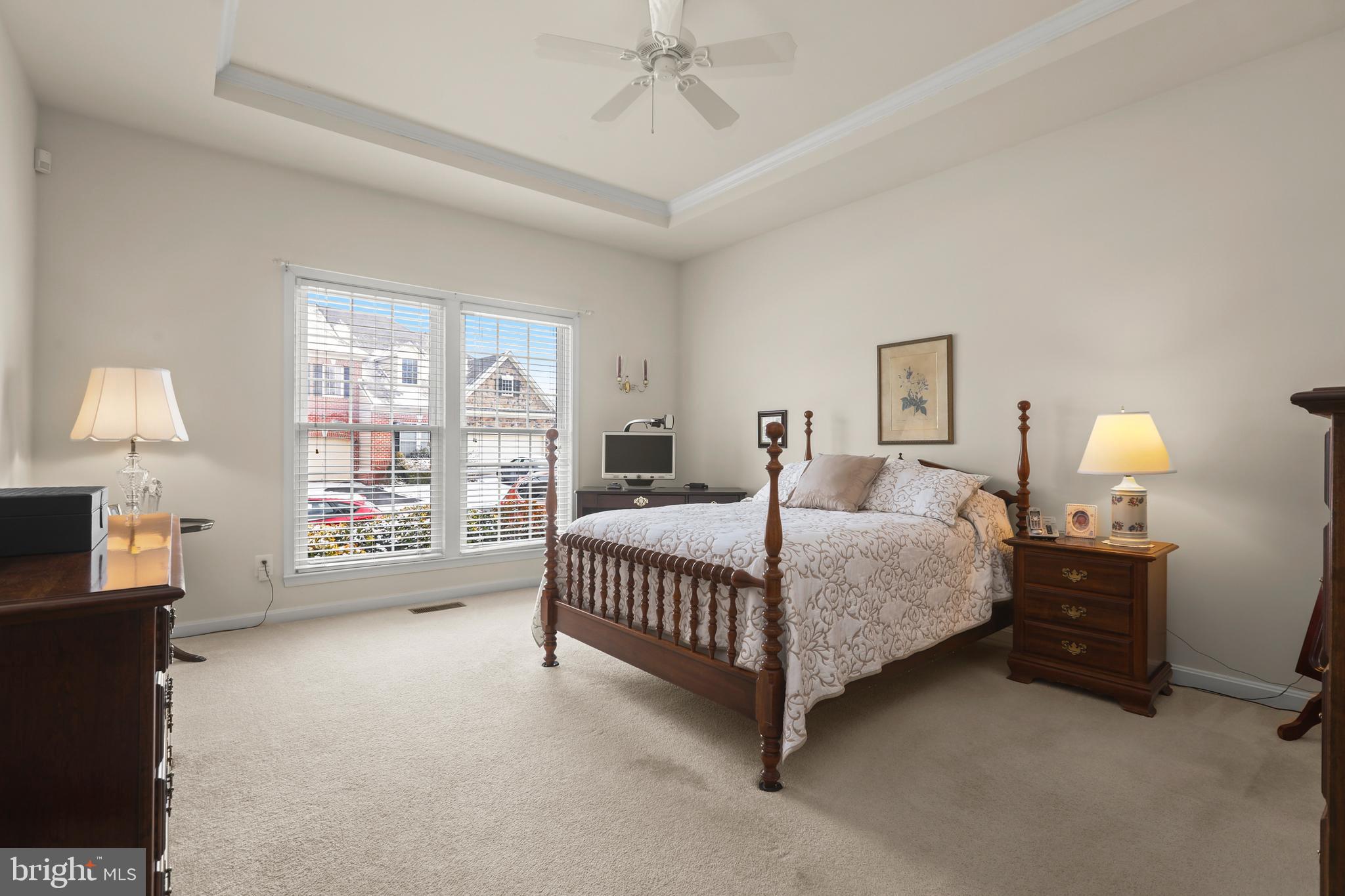 804 Bridle Path Bel Air, MD 21014 - Photo 26 of 53 a spacious bedroom with a bed and a lamp on dresser