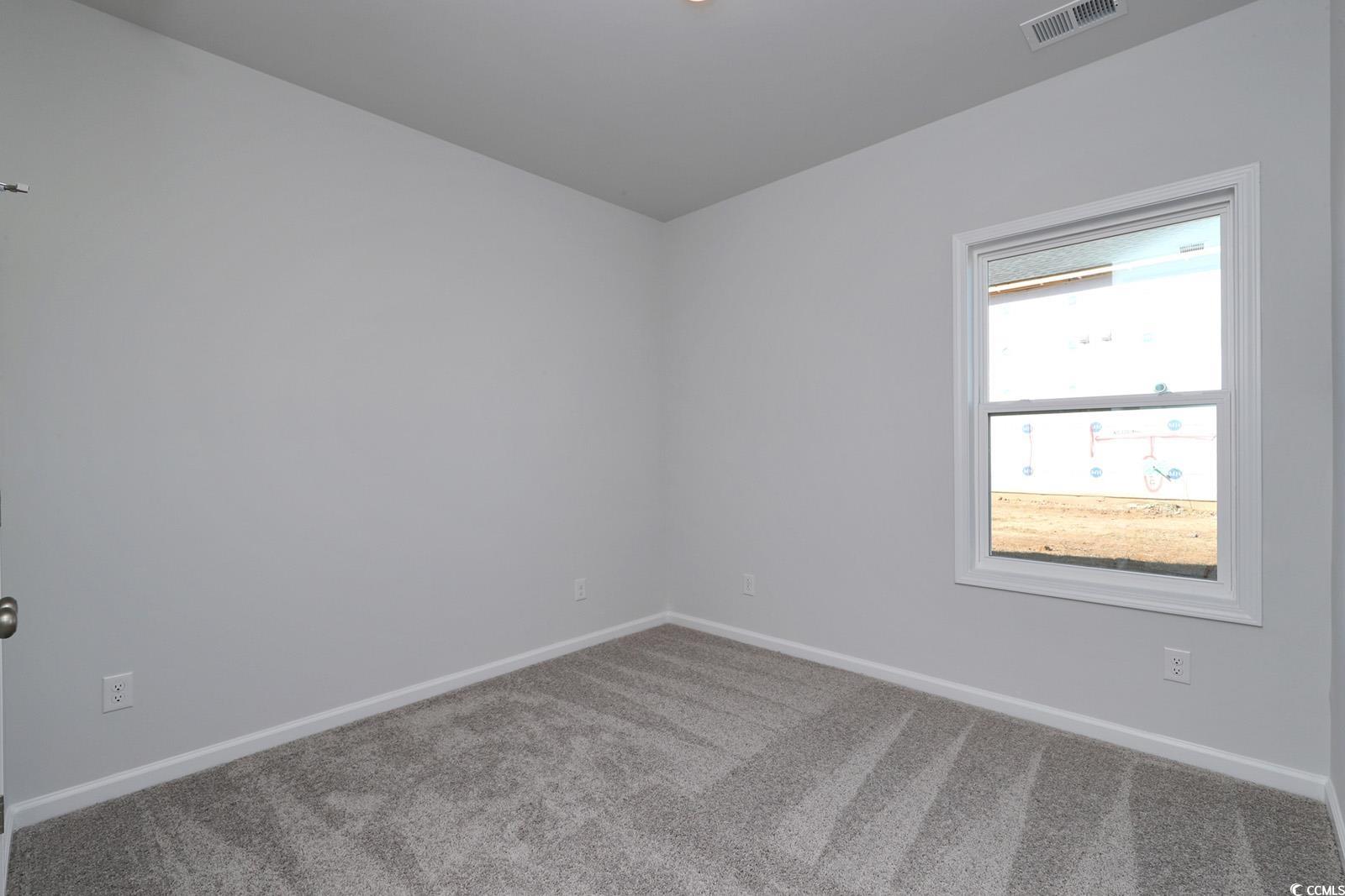235 Sundrop Way Conway, SC 29526 - Photo 19 of 24 Carpeted spare room featuring baseboards