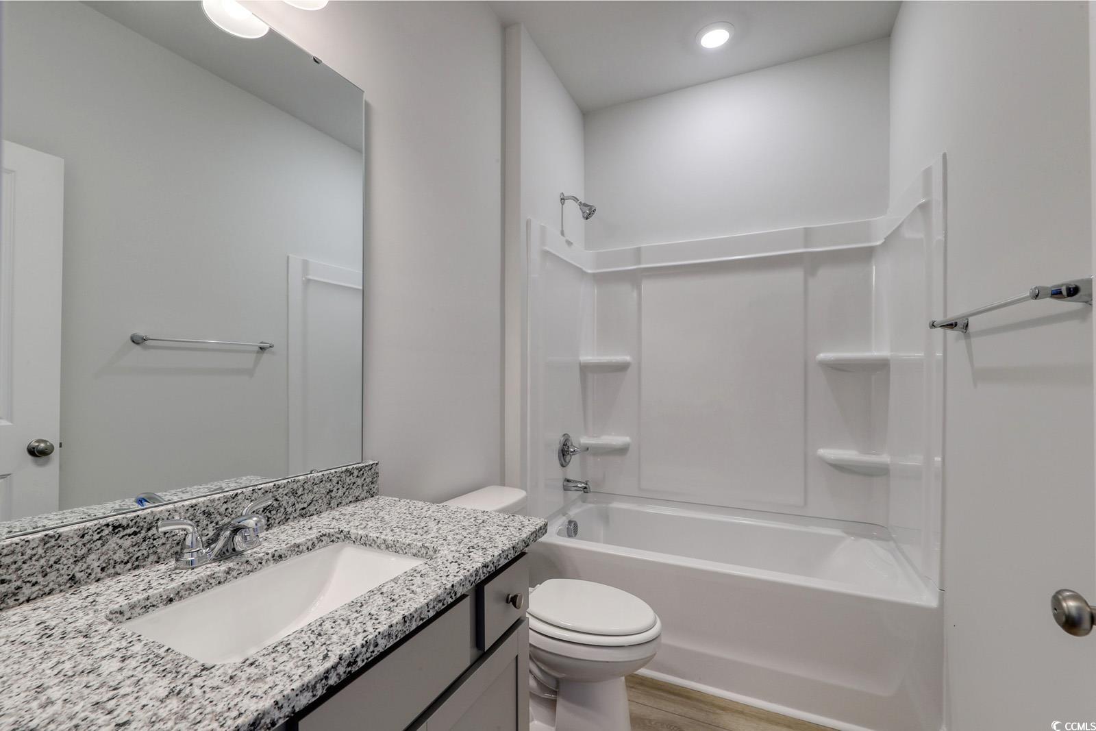 235 Sundrop Way Conway, SC 29526 - Photo 21 of 24 Full bathroom featuring shower / tub combination, vanity, and light wood-type flooring