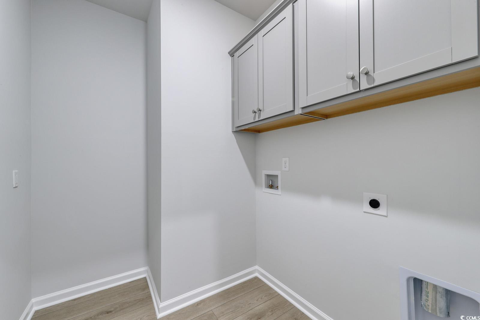235 Sundrop Way Conway, SC 29526 - Photo 22 of 24 Laundry area featuring light wood-style floors, cabinet space, washer hookup, and hookup for an electric dryer