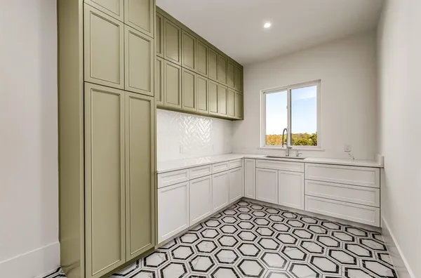a view of empty room with window and wooden floor