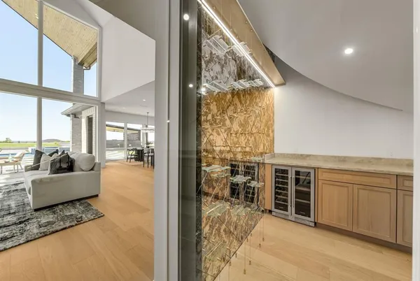 a view of living room with furniture and floor to ceiling window