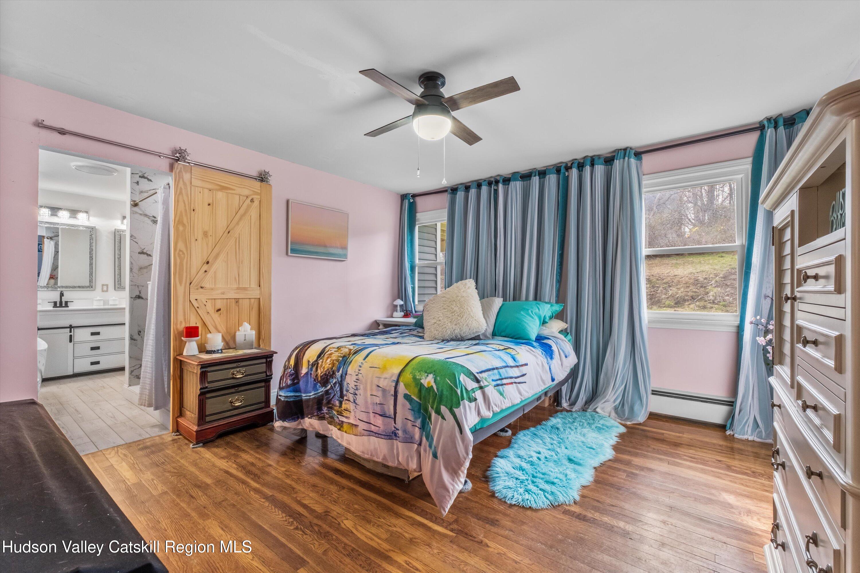 6 Smith Terrace Lloyd, NY 12528 - Photo 14 of 33 a bedroom with a bed and a chandelier