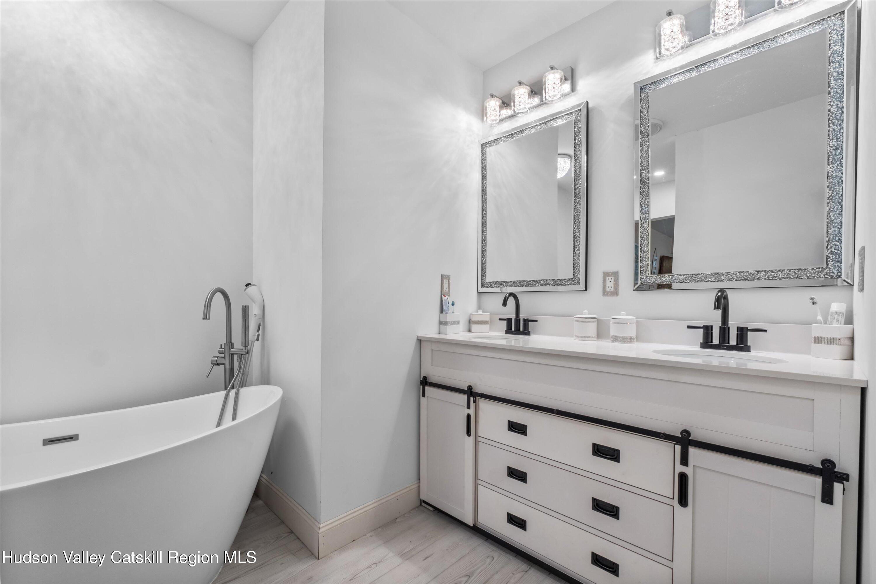 6 Smith Terrace Lloyd, NY 12528 - Photo 17 of 33 a bathroom with a tub sink and mirror