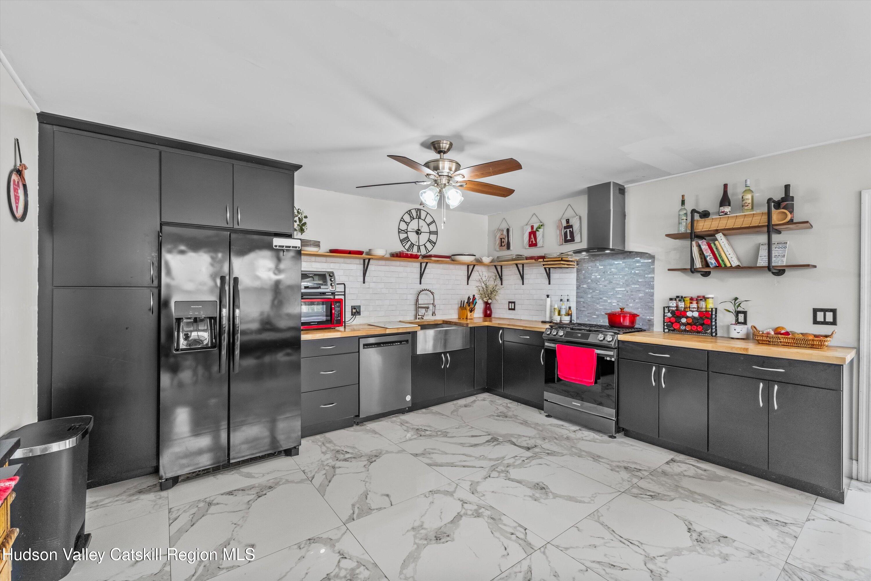 6 Smith Terrace Lloyd, NY 12528 - Photo 3 of 33 a kitchen with refrigerator and cabinets