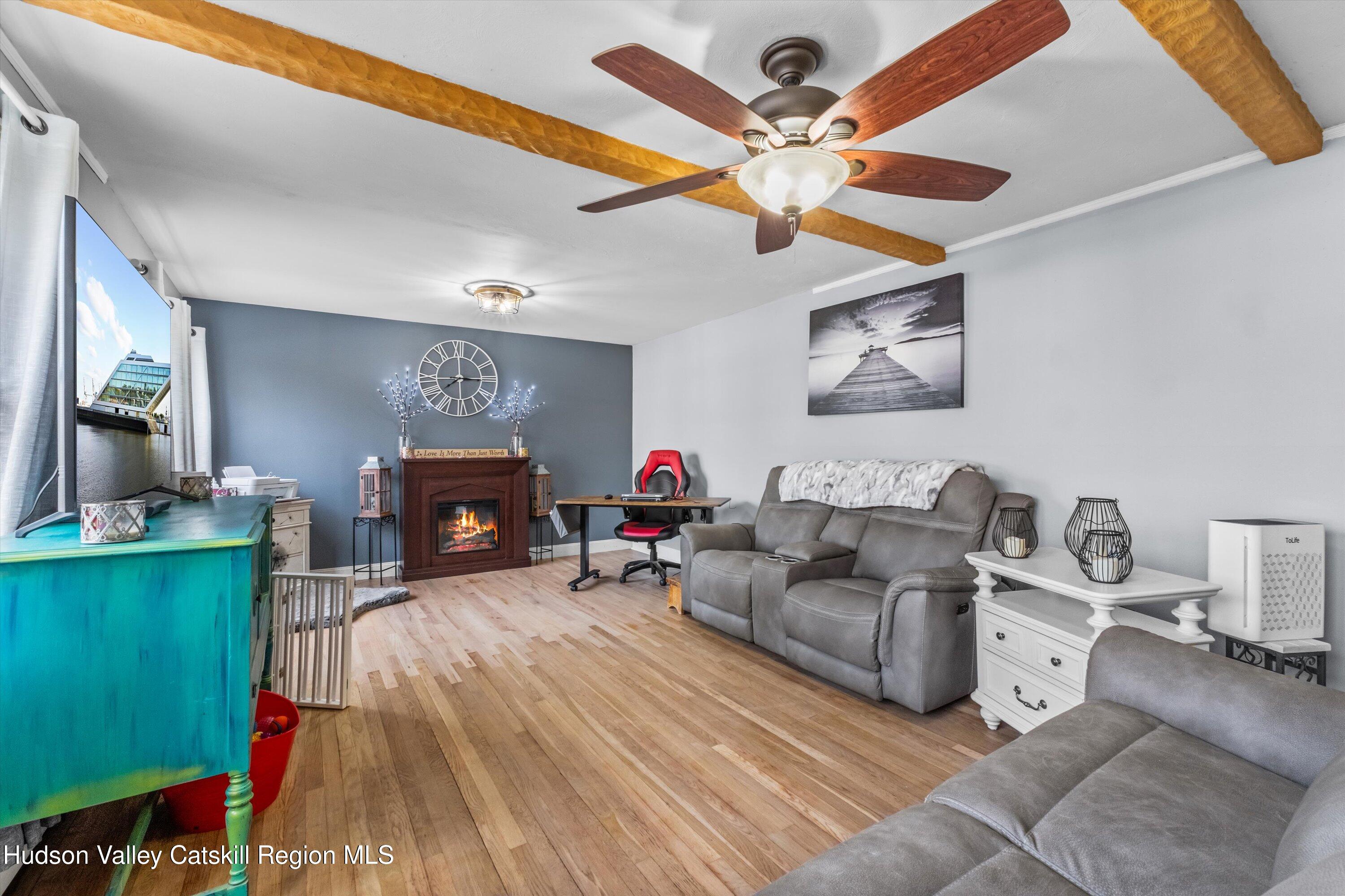 6 Smith Terrace Lloyd, NY 12528 - Photo 7 of 33 a living room with furniture and a fireplace