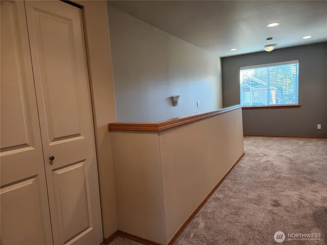a bathroom with a granite countertop shower and a sink