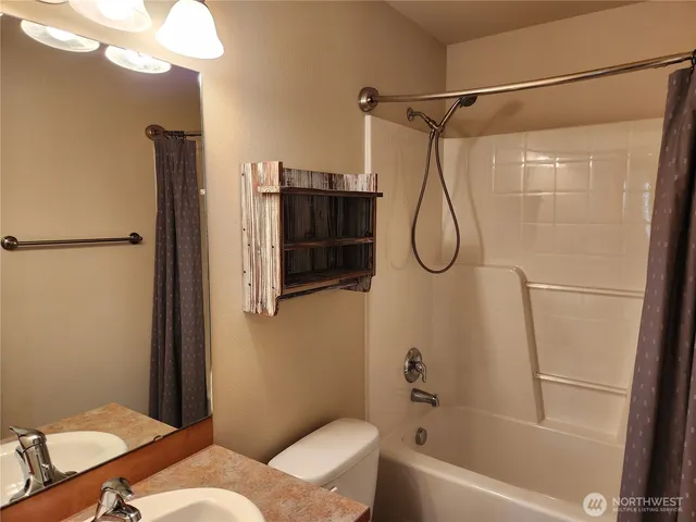 a view of a room with wooden walls