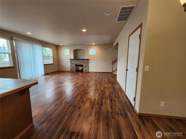 a view of a livingroom with furniture and wooden floor