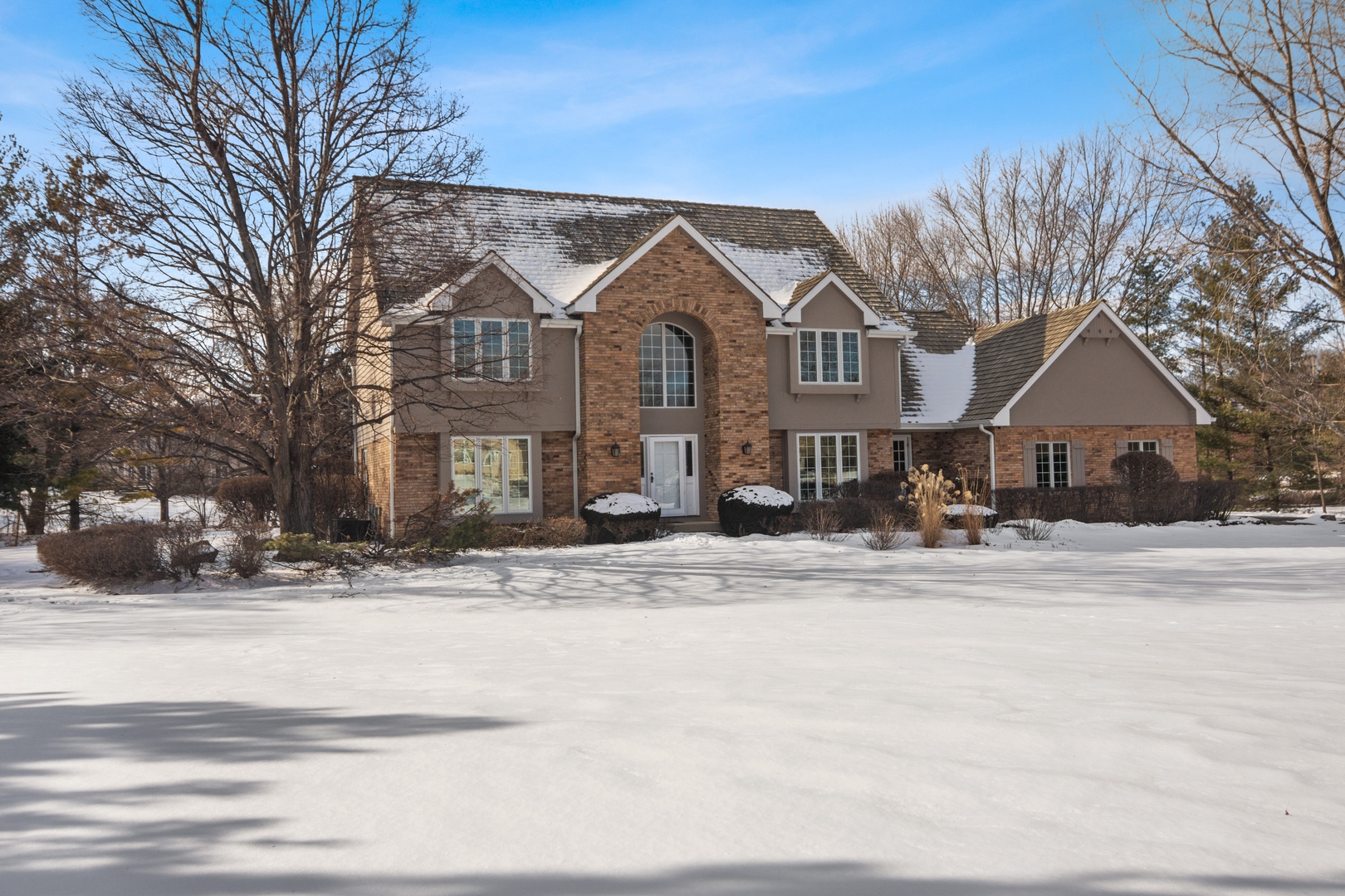 a front view of a house with a yard