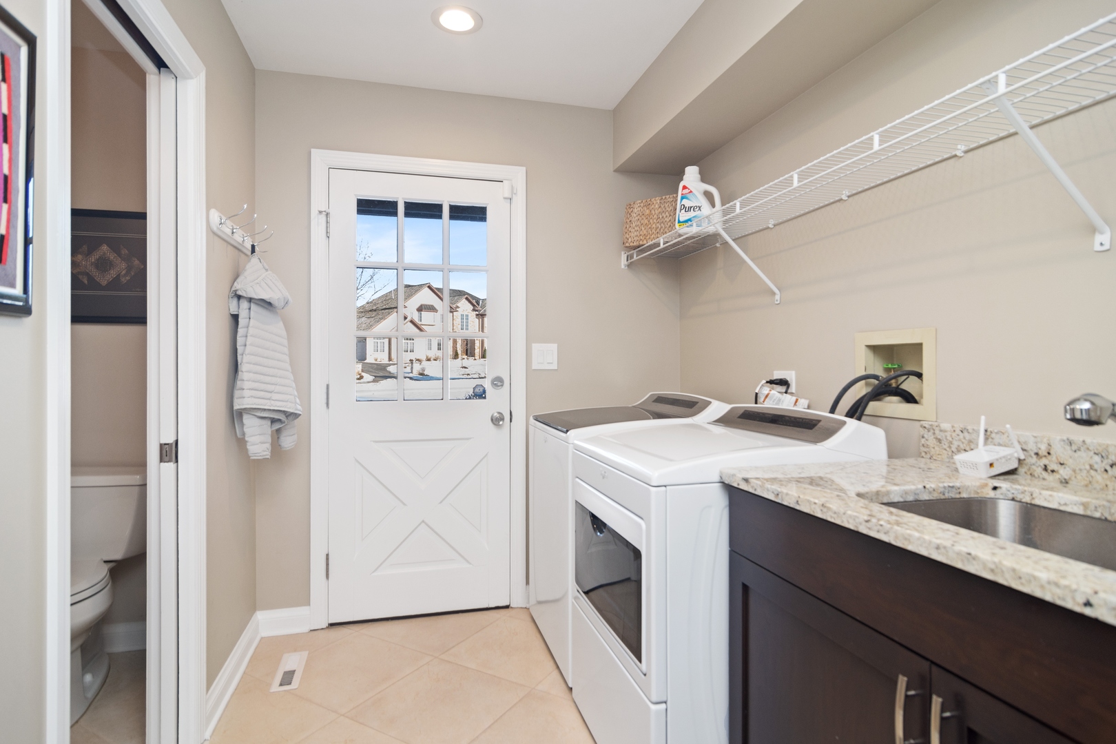 6238 Pine Tree Drive Long Grove, IL 60047 - Photo 13 of 28 a utility room with cabinets washer and dryer