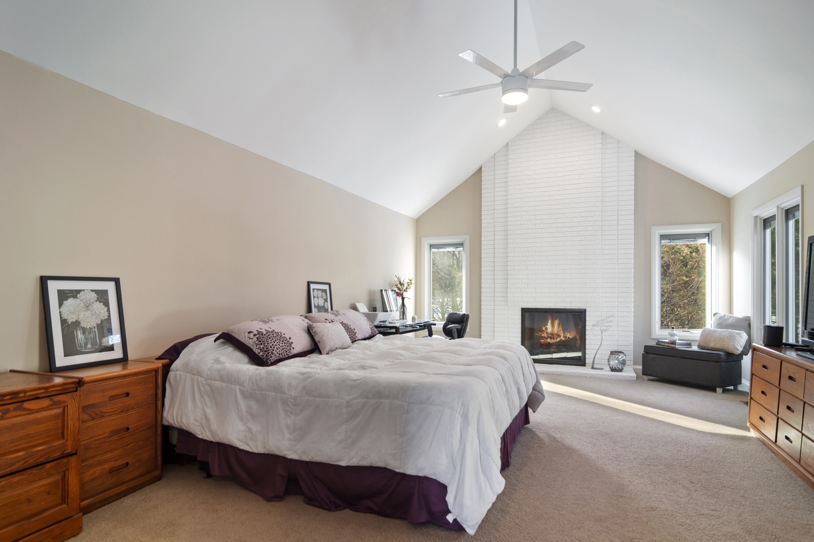 6238 Pine Tree Drive Long Grove, IL 60047 - Photo 15 of 28 a spacious bedroom with a bed and a chandelier