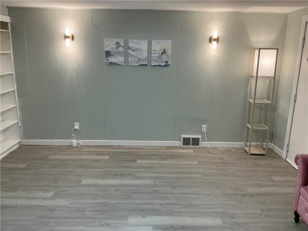 3326 Spring Garden Road Pittsburgh, PA 15212 - Photo 17 of 21 a view of an empty room with wooden floor