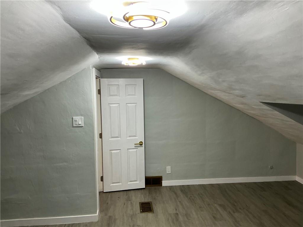 3326 Spring Garden Road Pittsburgh, PA 15212 - Photo 2 of 21 an empty room with wooden floor and windows