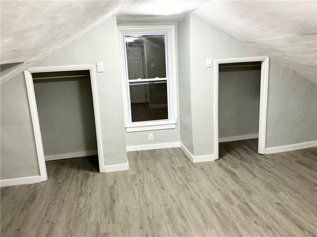 3326 Spring Garden Road Pittsburgh, PA 15212 - Photo 4 of 21 an empty room with wooden floor and closet