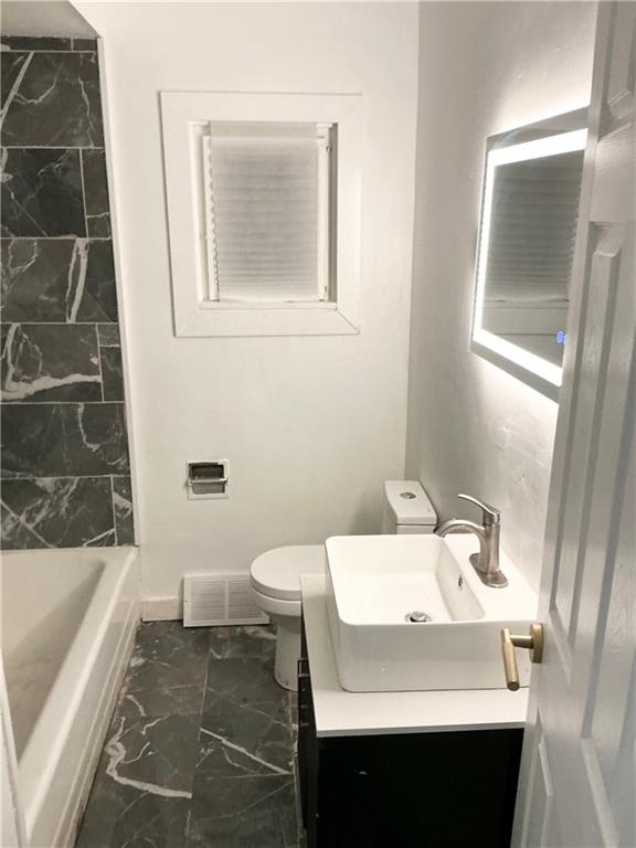 3326 Spring Garden Road Pittsburgh, PA 15212 - Photo 6 of 21 a bathroom with a sink and a mirror