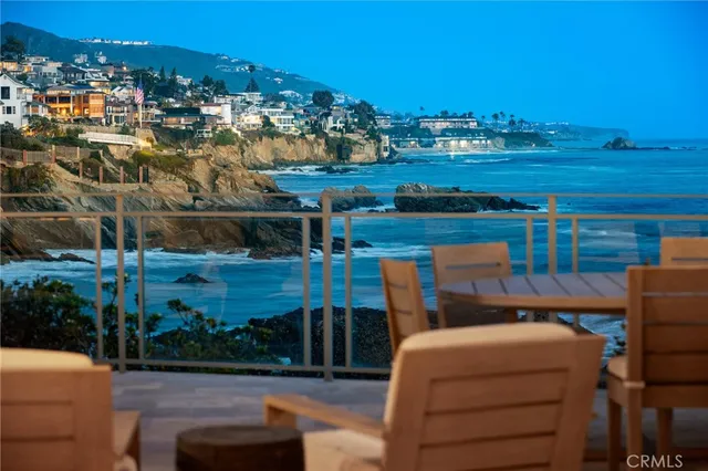 a view of a terrace with outdoor seating and city view