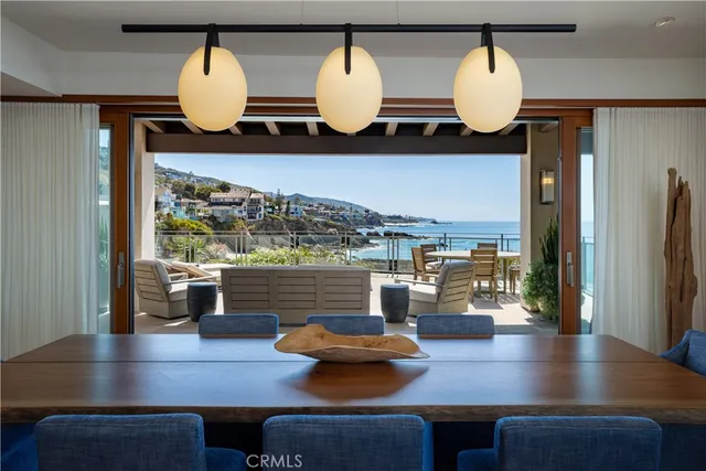 a living room with dining table and wooden floor