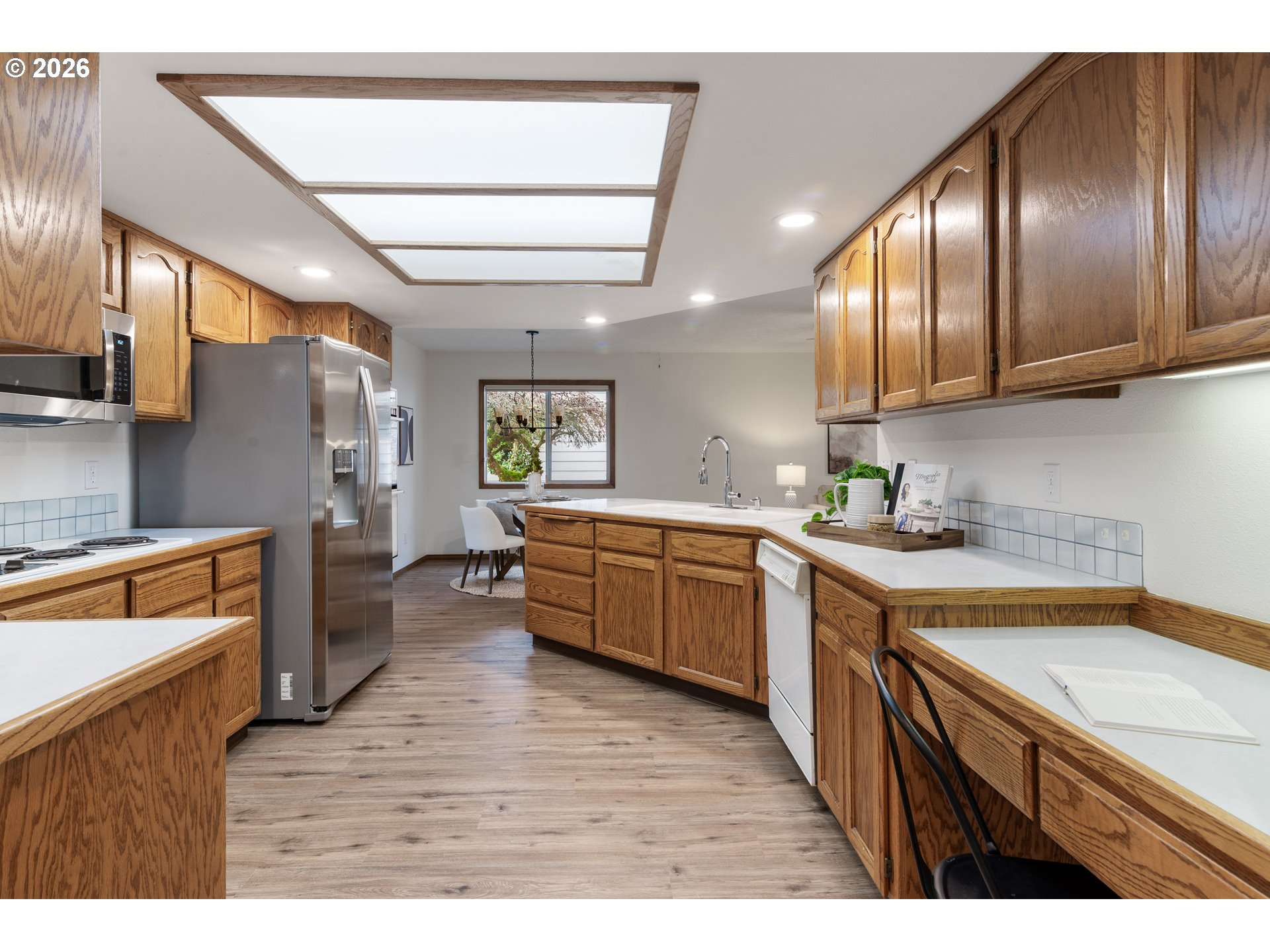 2730 Northeast Roberts Avenue Gresham, OR 97030 - Photo 11 of 43 a kitchen with stainless steel appliances granite countertop a sink a stove counter space and cabinets