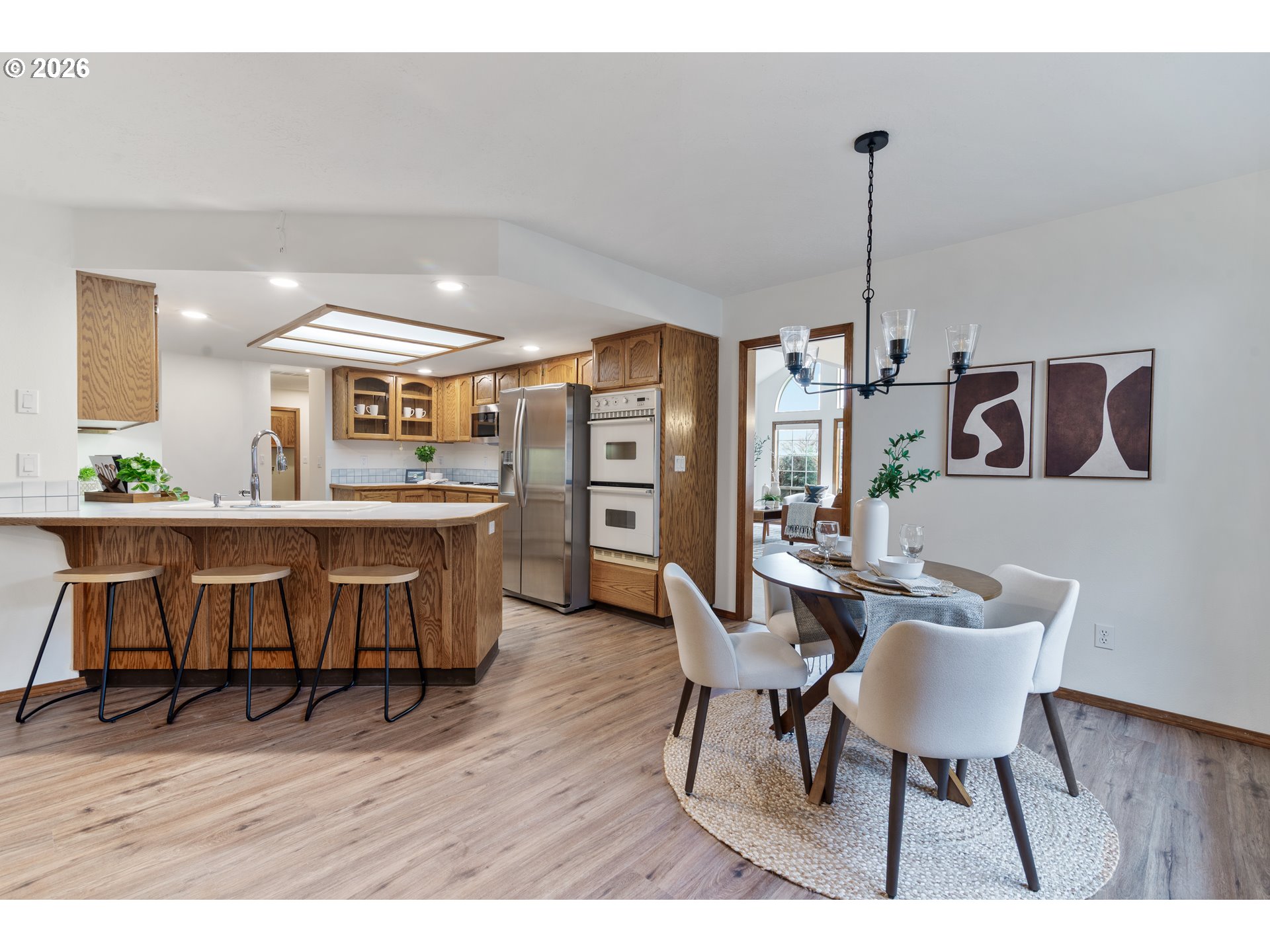 2730 Northeast Roberts Avenue Gresham, OR 97030 - Photo 13 of 43 a view of a dining room with furniture and wooden floor