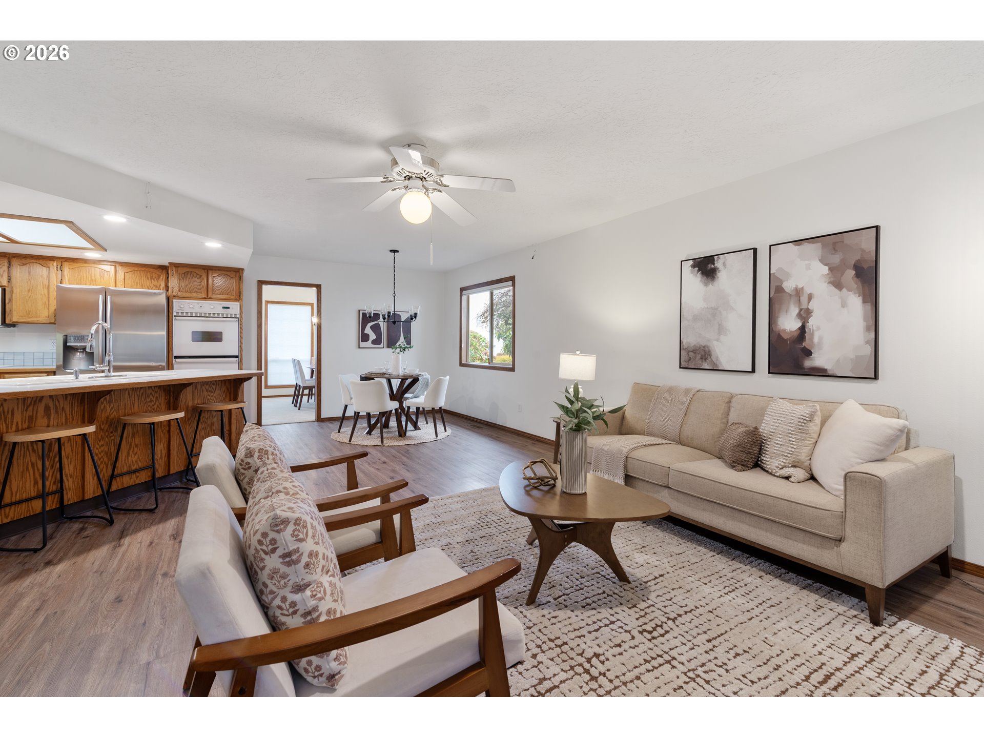 2730 Northeast Roberts Avenue Gresham, OR 97030 - Photo 18 of 43 a living room with furniture or couch and a wooden floor