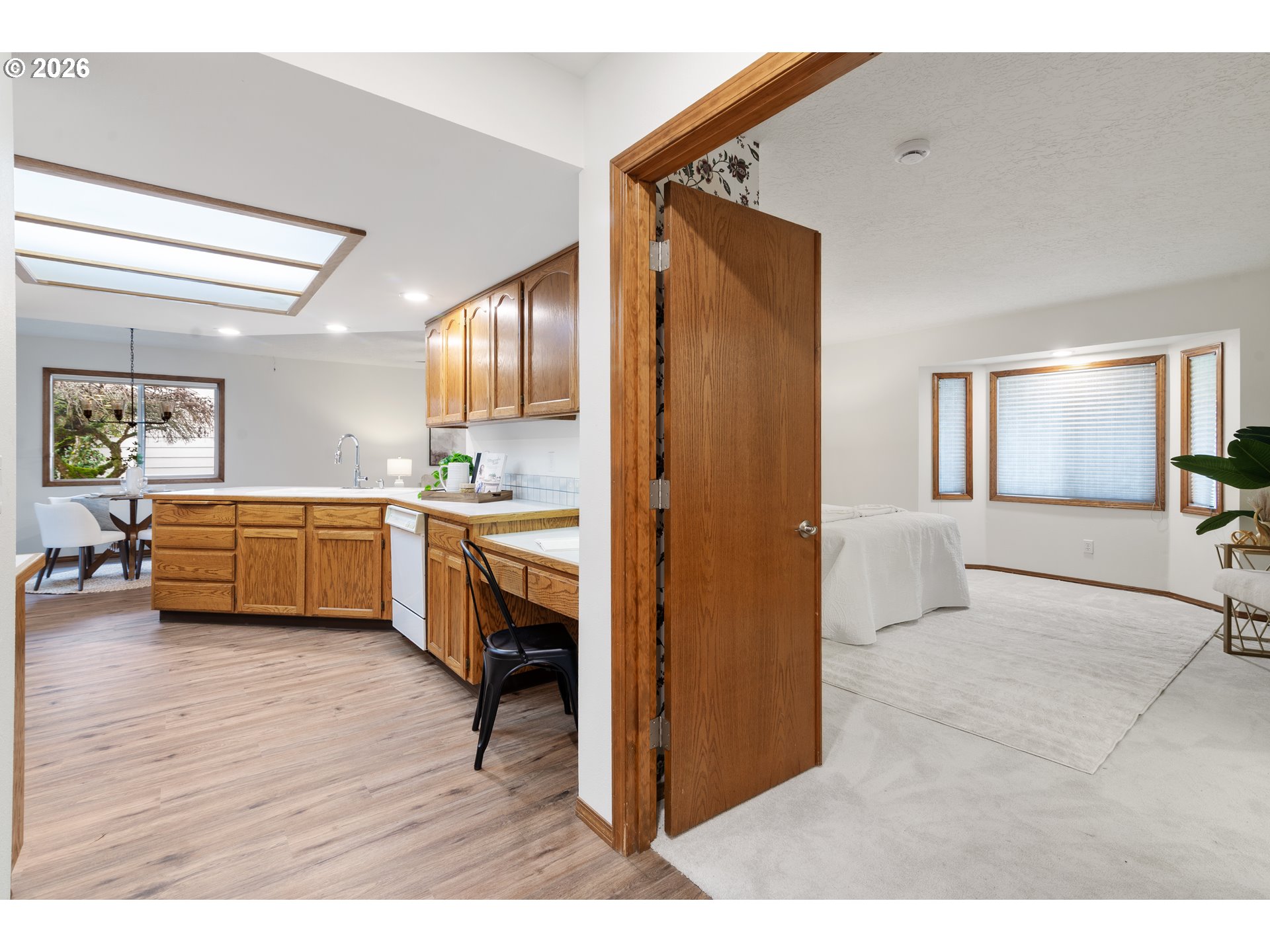 2730 Northeast Roberts Avenue Gresham, OR 97030 - Photo 21 of 43 a view of living room kitchen with furniture and wooden floor
