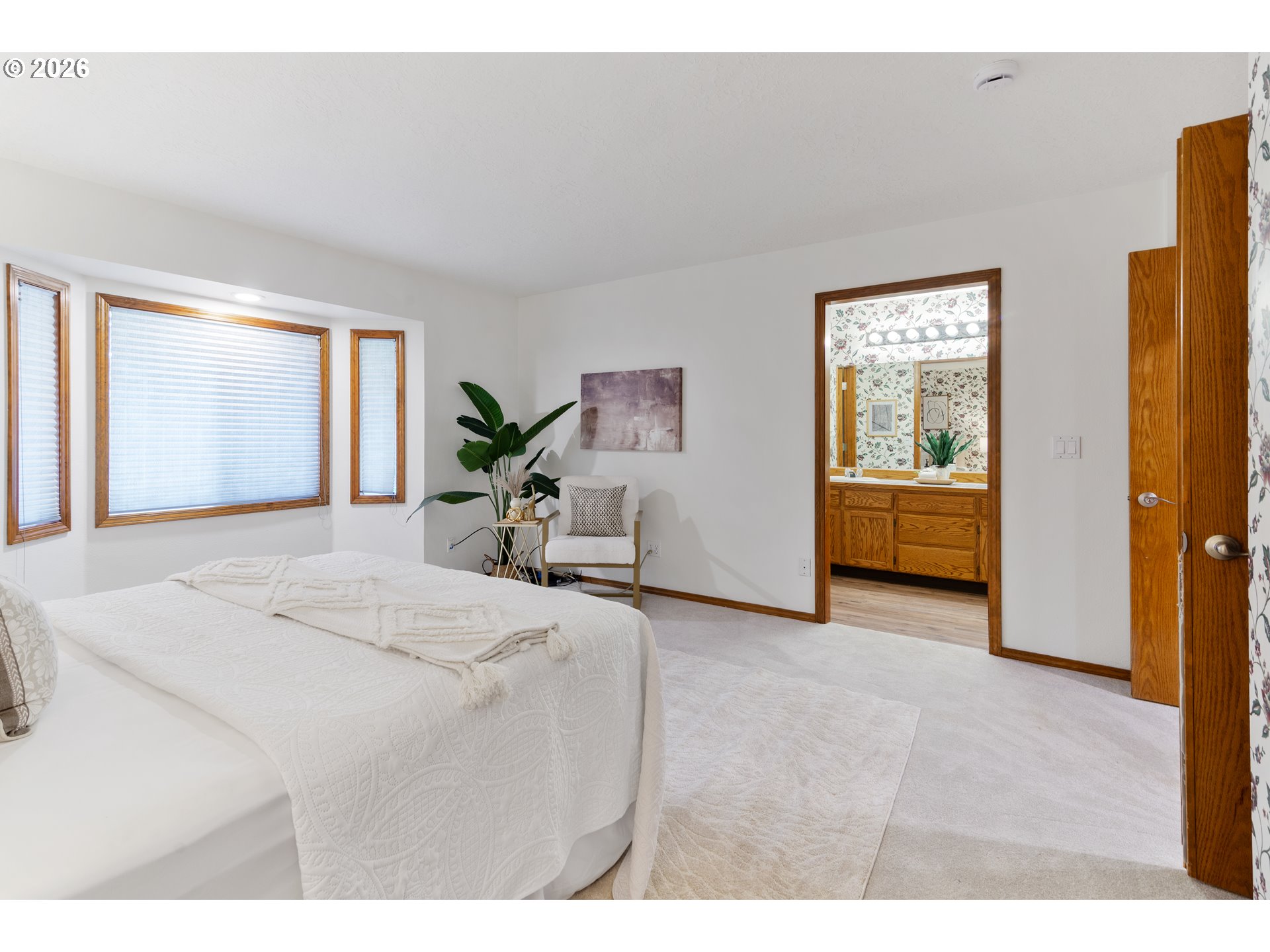 2730 Northeast Roberts Avenue Gresham, OR 97030 - Photo 24 of 43 a bedroom with a bed and a table