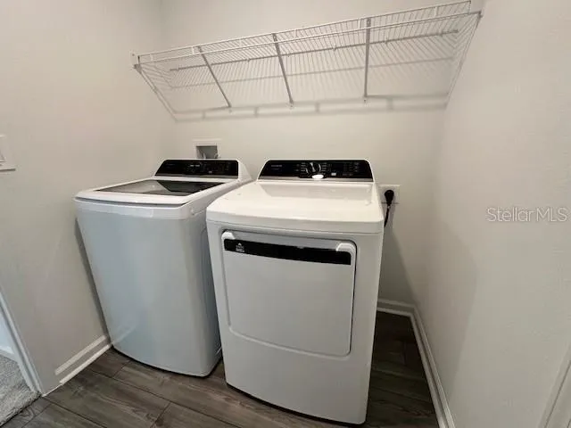 a utility room with dryer and washer