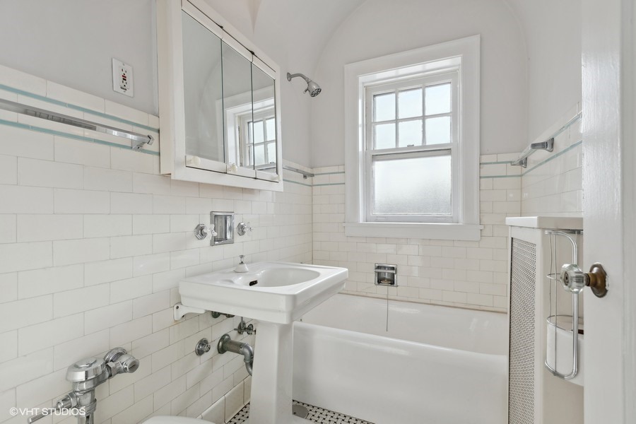 478 Sheridan Road, Unit 2 Evanston, IL 60202 - Photo 12 of 16 a bathroom with a sink and a window