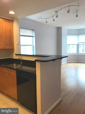 a kitchen with a sink and a refrigerator