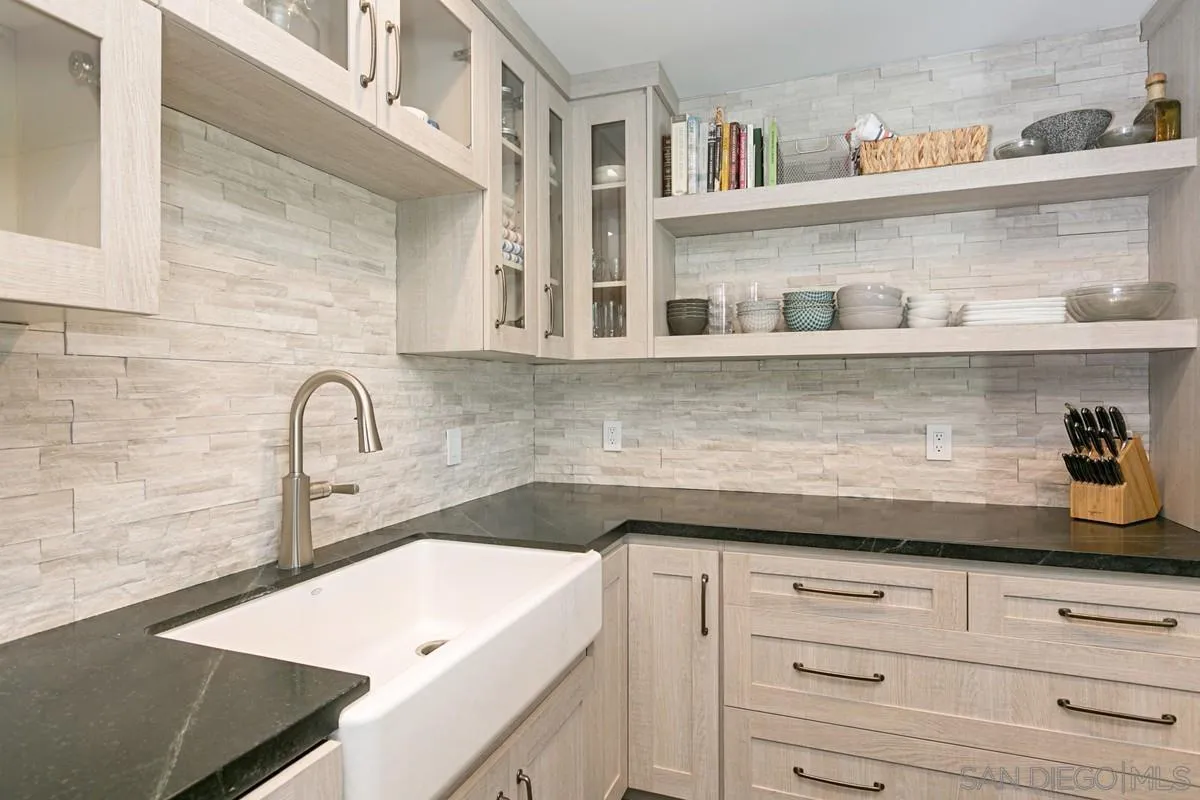 450 Summer View Circle Encinitas, CA 92024 - Photo 11 of 30 a close view of a kitchen sink stove and cabinets