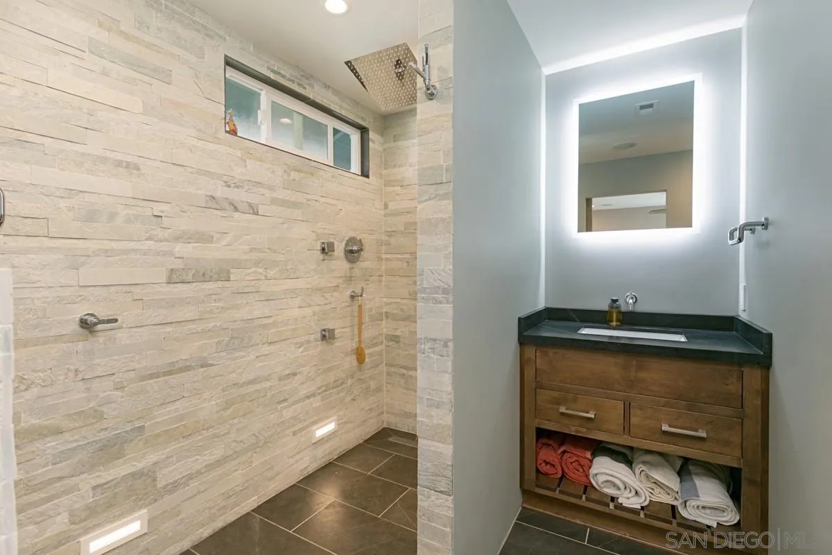 450 Summer View Circle Encinitas, CA 92024 - Photo 17 of 30 a bathroom with a sink a toilet and mirror