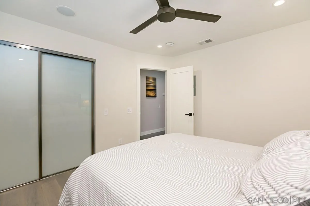 450 Summer View Circle Encinitas, CA 92024 - Photo 21 of 30 a bedroom with a bed and a mirror