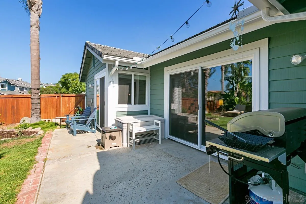 450 Summer View Circle Encinitas, CA 92024 - Photo 24 of 30 a backyard of a house with barbeque oven table and chairs