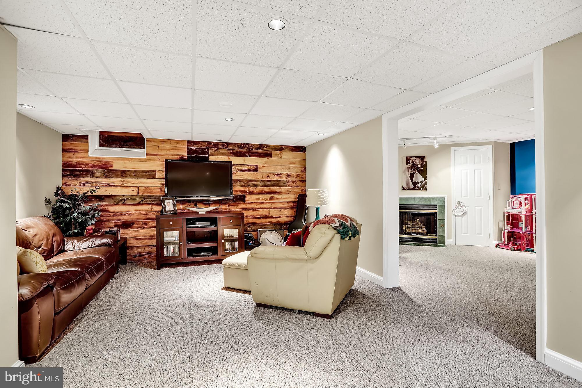 893 Slate Hill Road Yardley, PA 19067 - Photo 27 of 36 Basement with gas fireplace