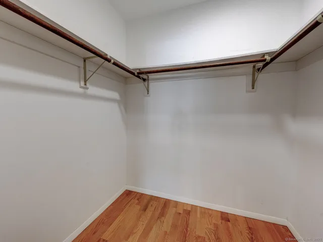 a view of a room with shelf on the wall