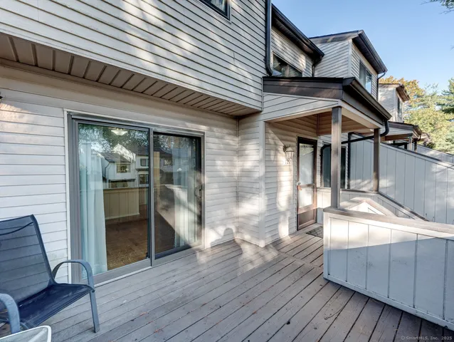 a view of a house with wooden deck