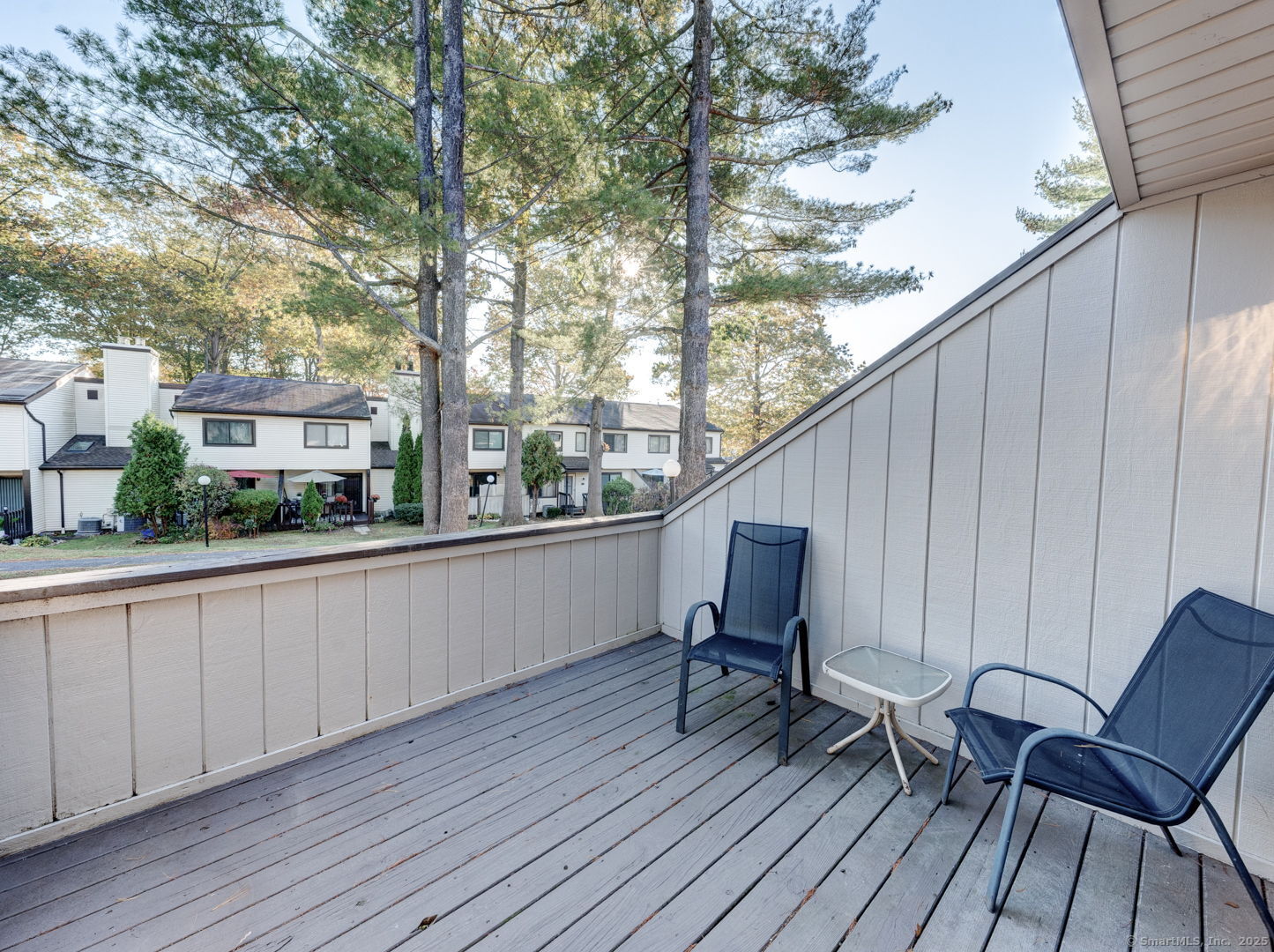 122 Cottonwood Road, Unit 122 Newington, CT 06111 - Photo 8 of 31 a balcony with table and chairs