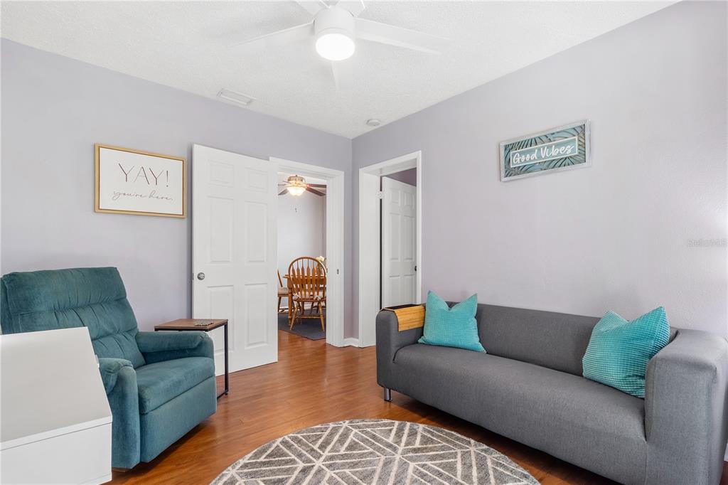 5596 100th Way North St. Petersburg, FL 33708 - Photo 21 of 67 a living room with furniture and a couch